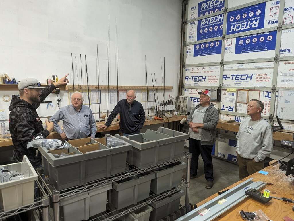 Hands-on custom rod building workshop with components laid out on a bench
